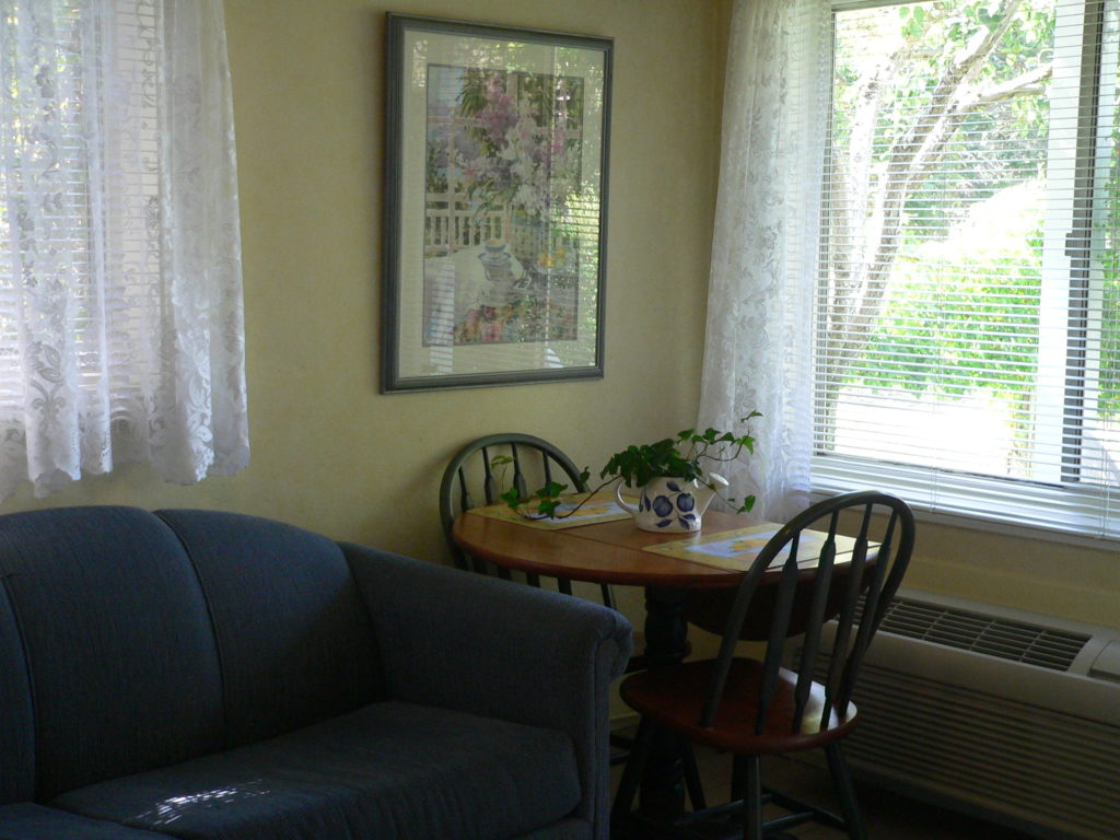 Love seat and table and chairs in the Cozy Kitchenette