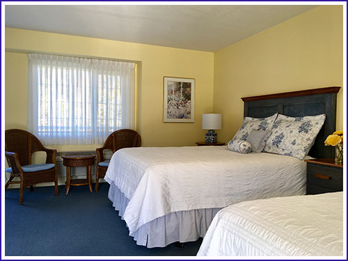 Two queen beds in the bright and spacious Deluxe  Lakeview Room 